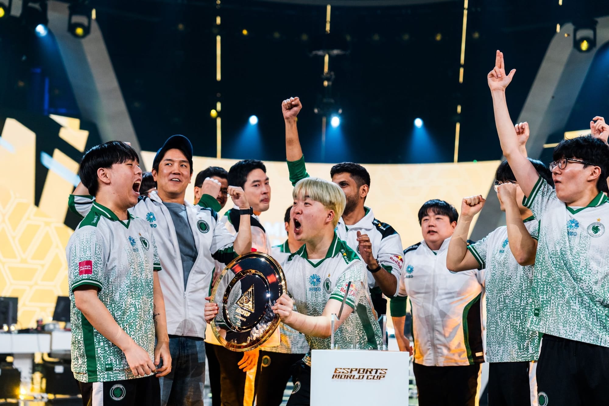 Team Falcons lift the 2025 Midseason Championship trophy at the Esports World Cup.